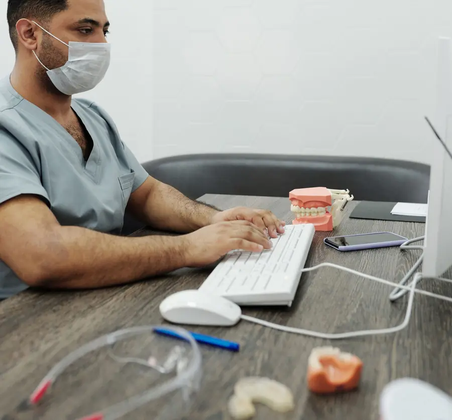 Dentist reviewing information at a desk